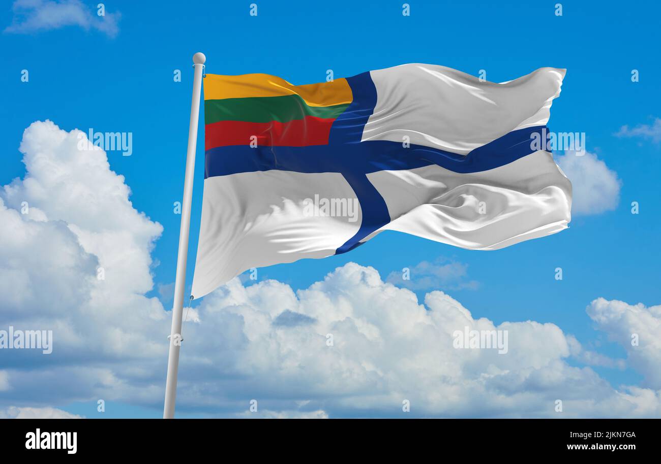 official flag of Naval Ensign lithuania at cloudy sky background on sunset, panoramic view. lithuanian travel and patriot concept. copy space for wide Stock Photo
