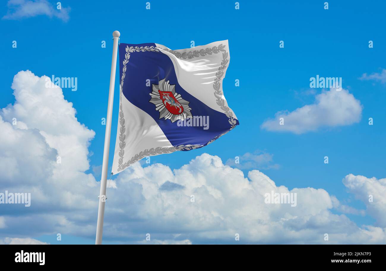 official flag of Police lithuania at cloudy sky background on sunset, panoramic view. lithuanian travel and patriot concept. copy space for wide banne Stock Photo