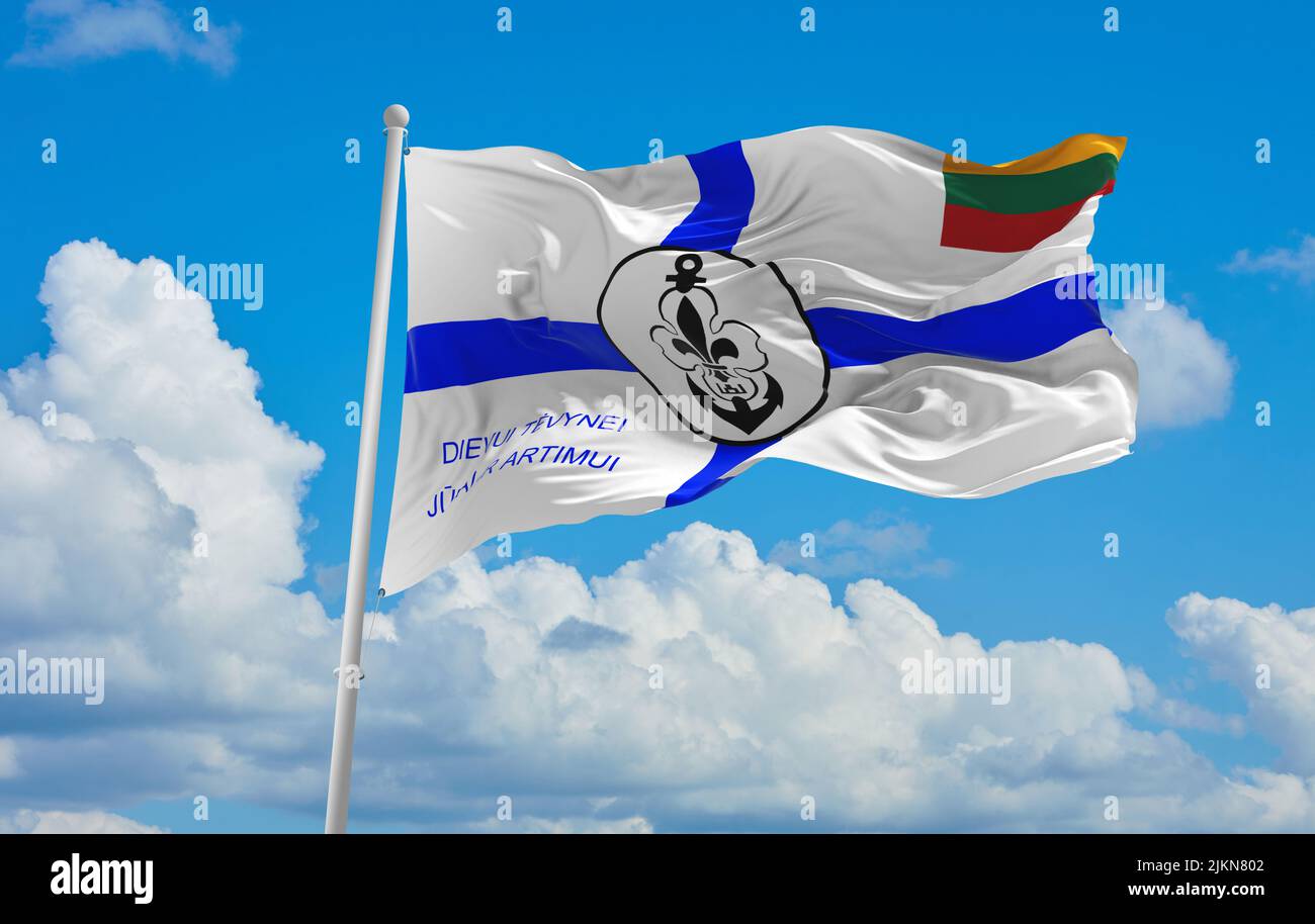 official flag of Sea Scout reverse lithuania at cloudy sky background on sunset, panoramic view. lithuanian travel and patriot concept. copy space for Stock Photo