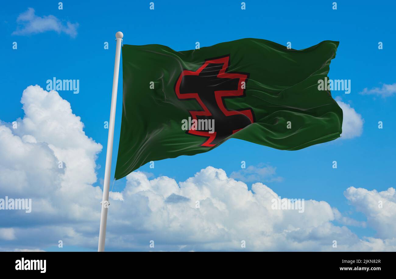 official flag of Special Operation Force lithuania at cloudy sky background on sunset, panoramic view. lithuanian travel and patriot concept. copy spa Stock Photo