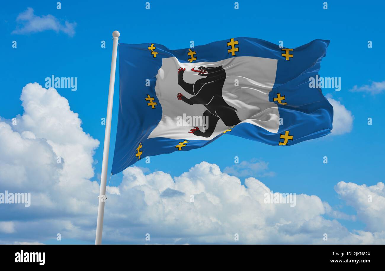 official flag of Siauliai County lithuania at cloudy sky background on sunset, panoramic view. lithuanian travel and patriot concept. copy space for w Stock Photo