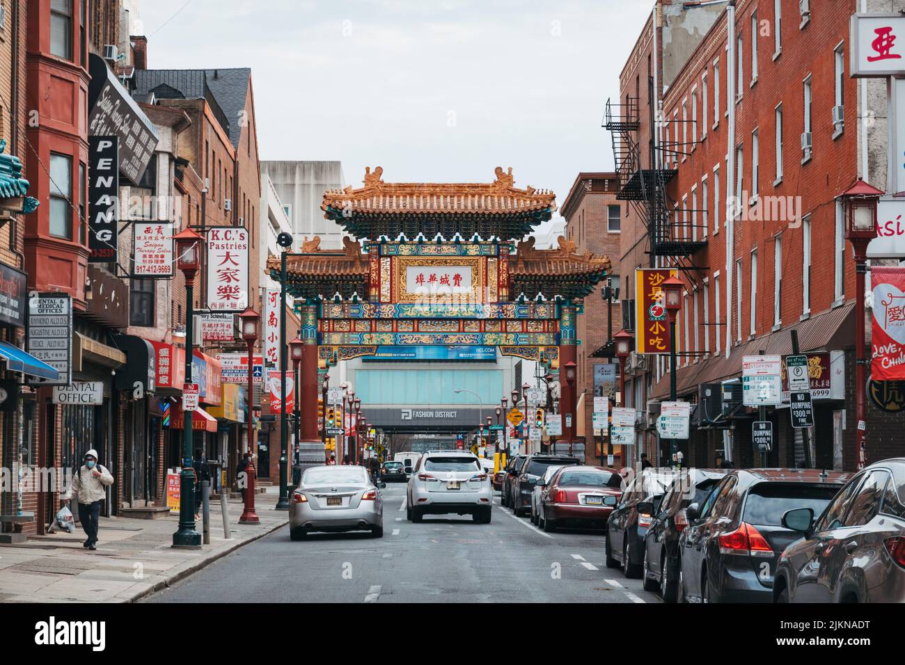 Looking down a street filled with restaurants, shops and other Chinese businesses in Chinatown, Philadelphia, USA Stock Photo