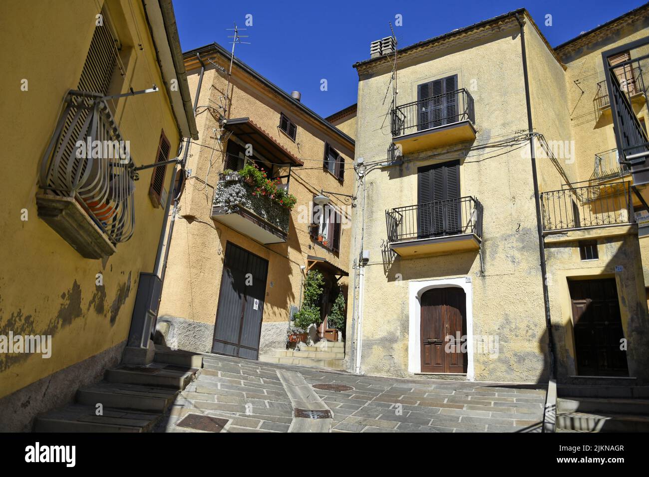 A narrow street in Calvello village in the Basilicata region of Italy ...