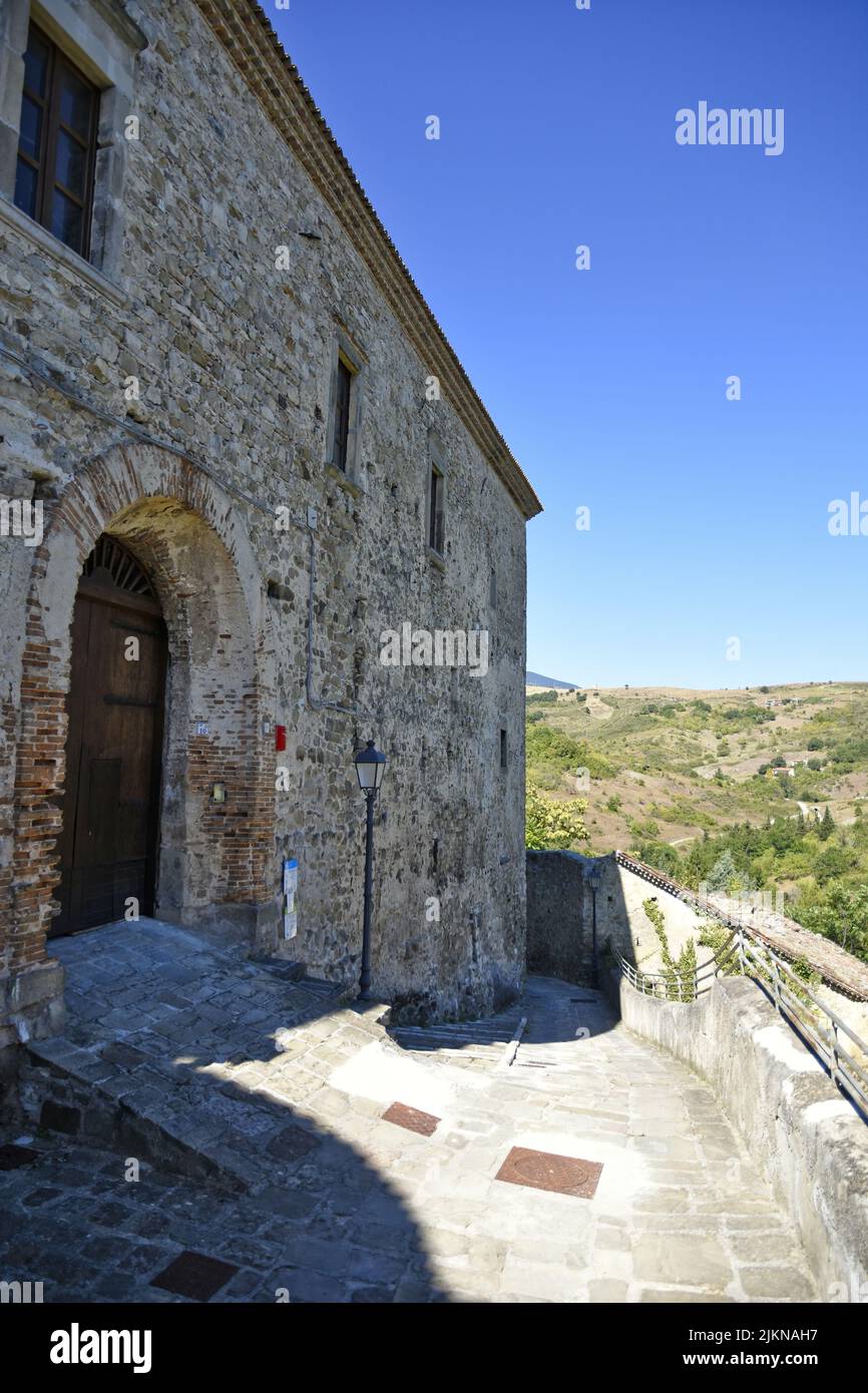 A vertical shot of the facade of an old building in Calvello village in ...