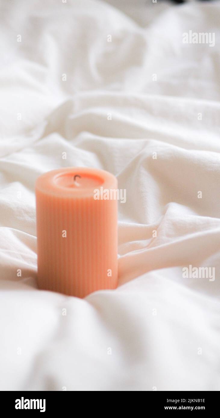 The Ribbed Pillar Candle in the white background for romantic times