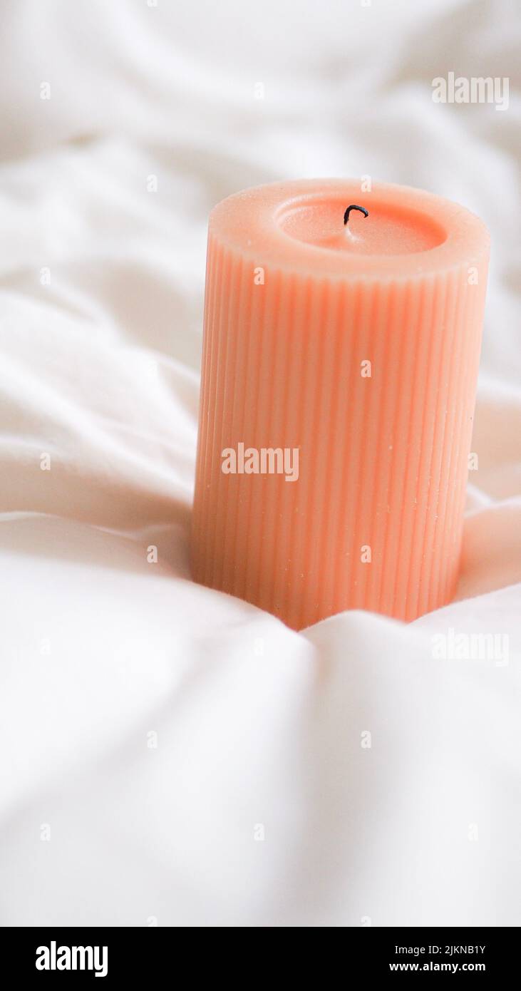 The Ribbed Pillar Candle in the white background for romantic times