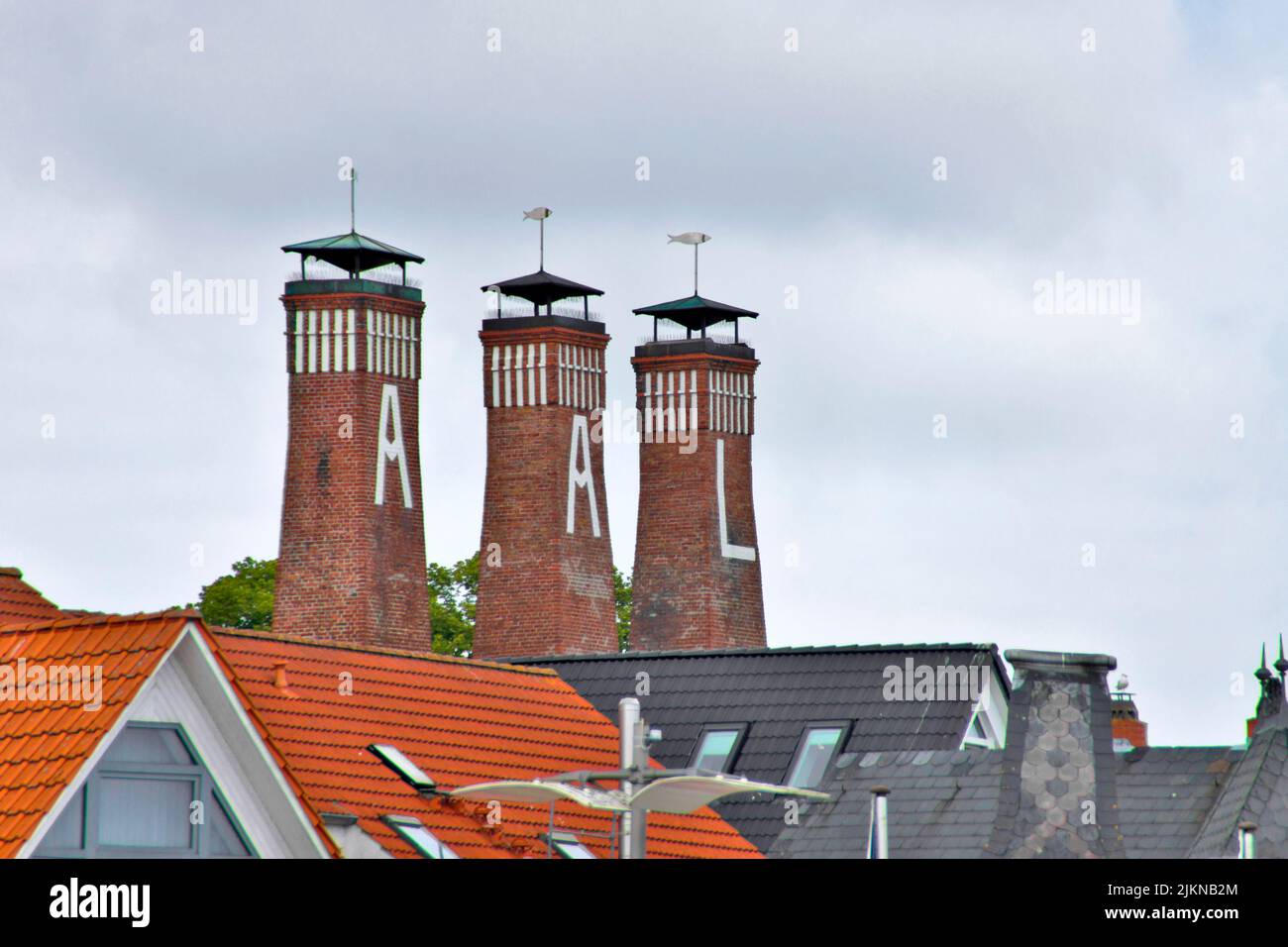 Three chimneys of a fish ingress in Kappeln at the Schlei in Northern Germany Stock Photo