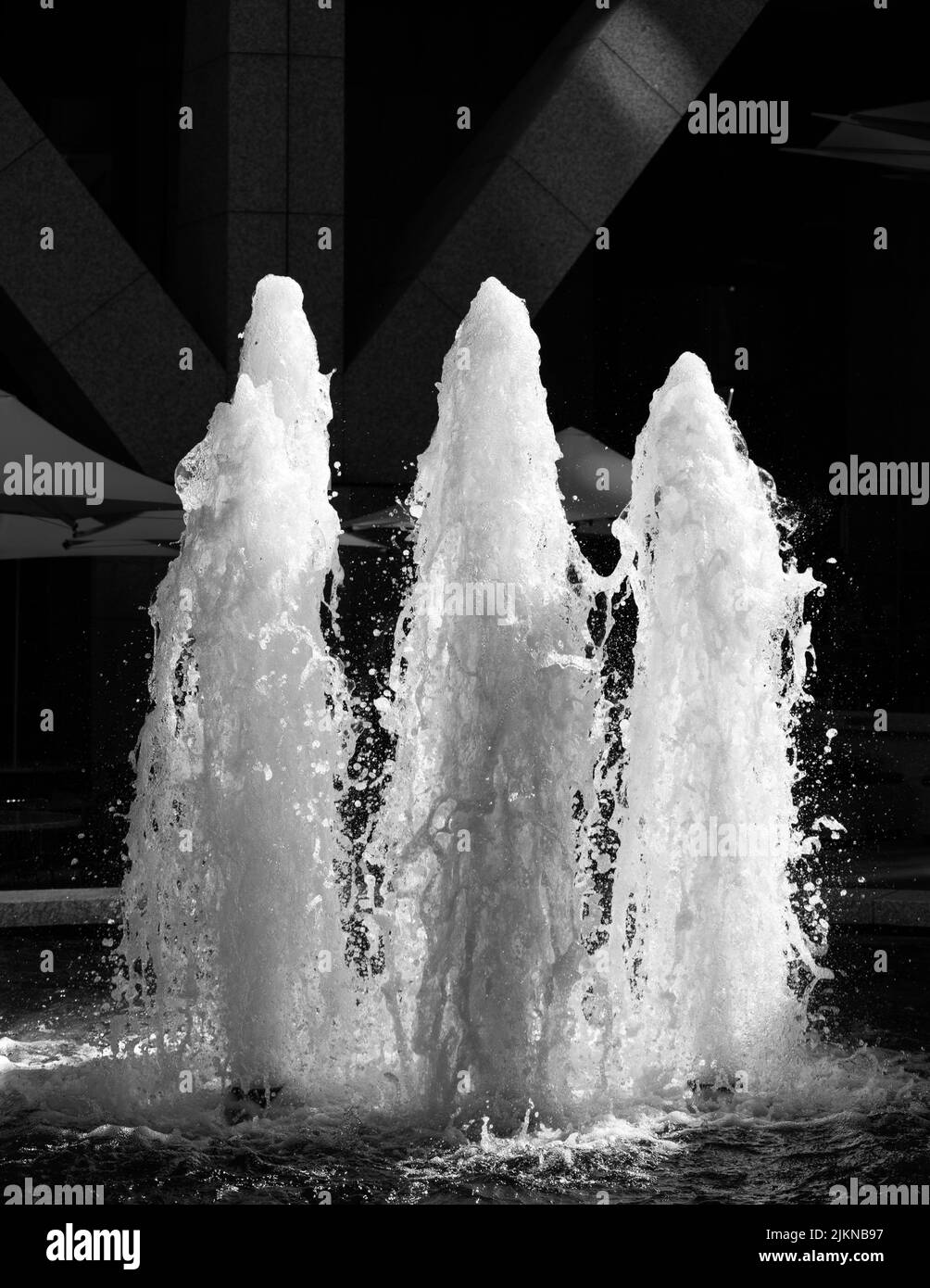 A grayscale shot of a fountains with blurred background Stock Photo
