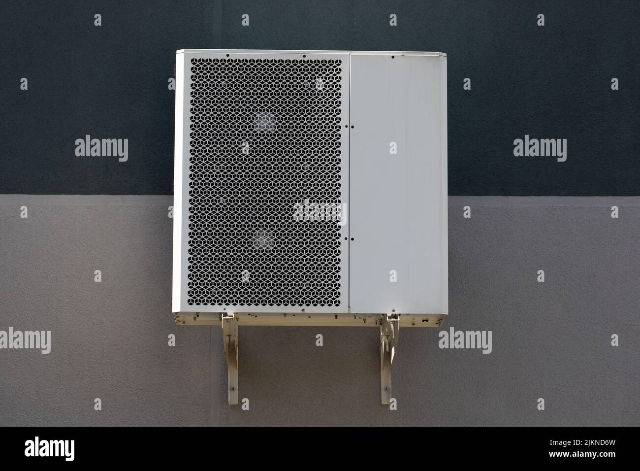 outdoor air conditioner unit on the wall of a building Stock Photo - Alamy