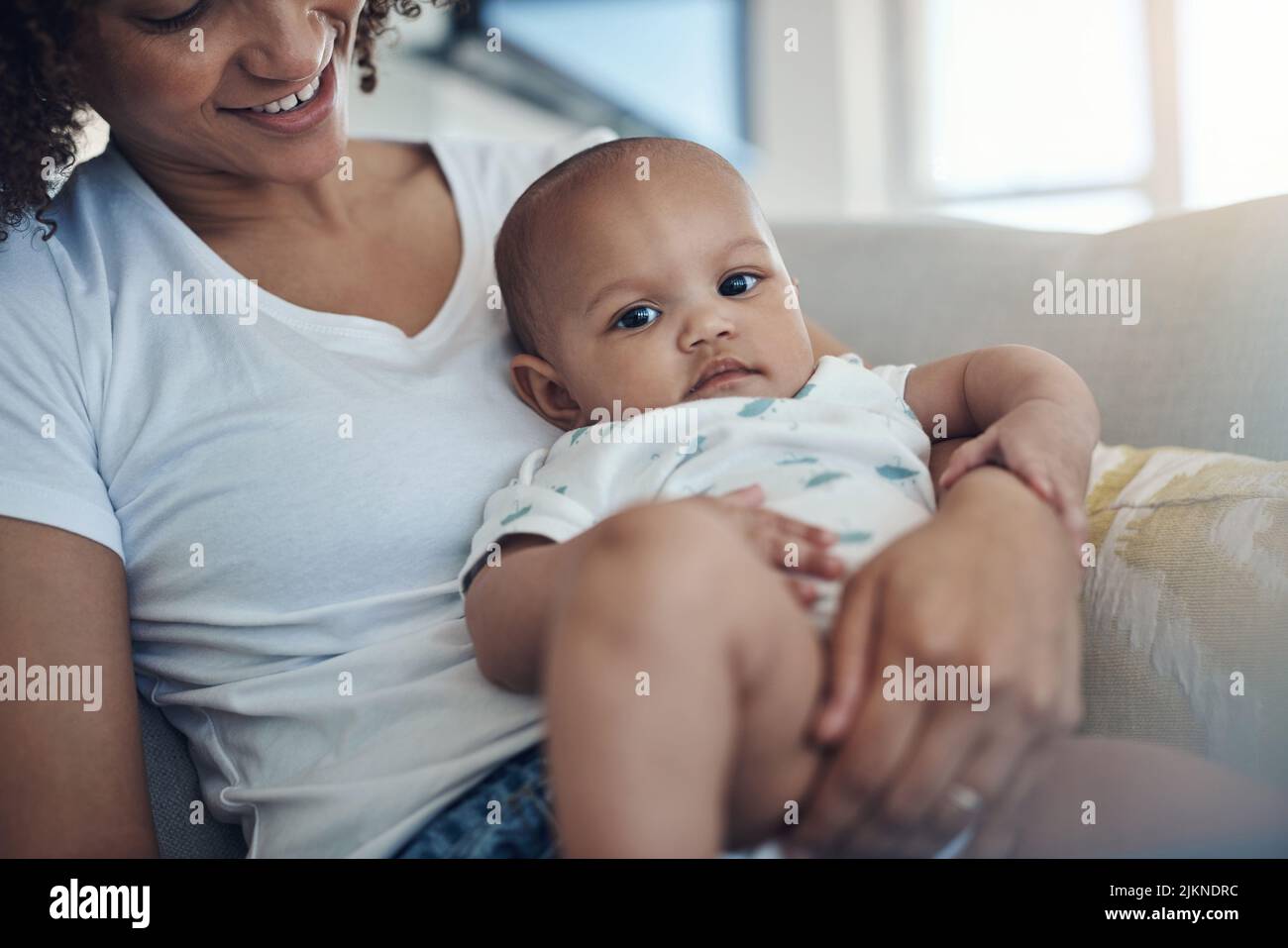 The comfiest place in the world is with mom. a young woman relaxing