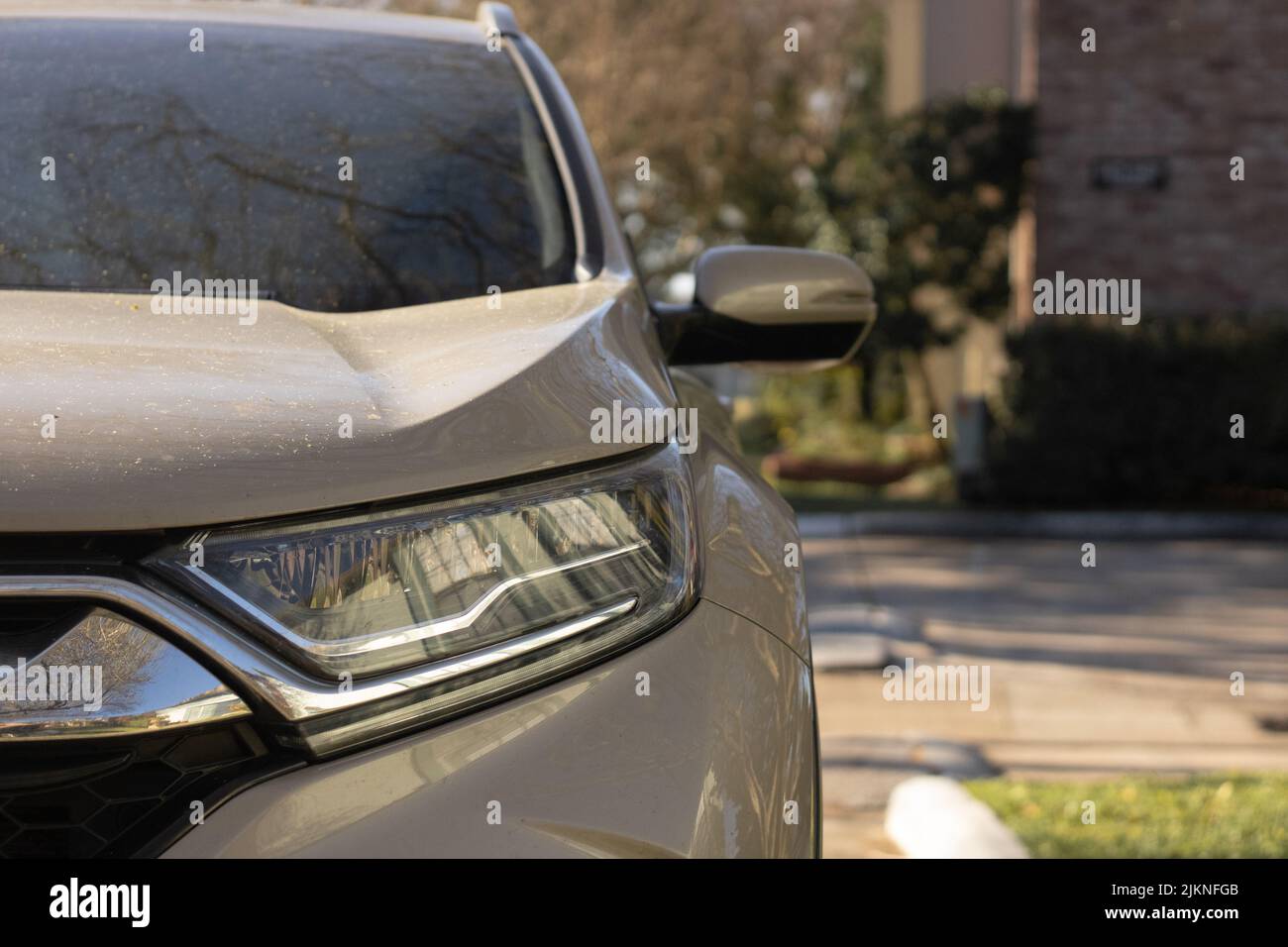 A suv sports utility vehicle in a small neighborhood Stock Photo