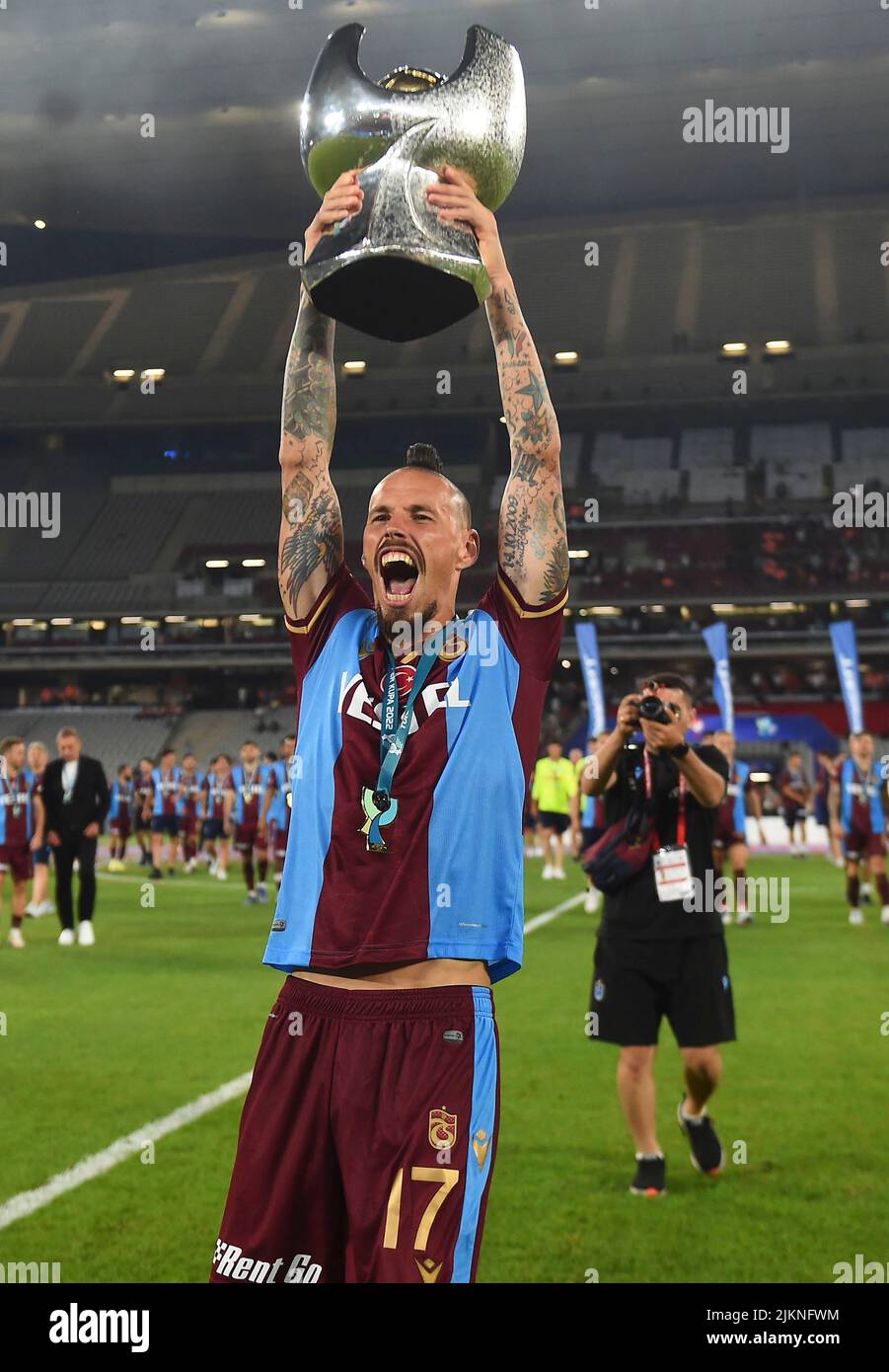 Trabzonspor player Marek Hamsik poses with their trophy after the