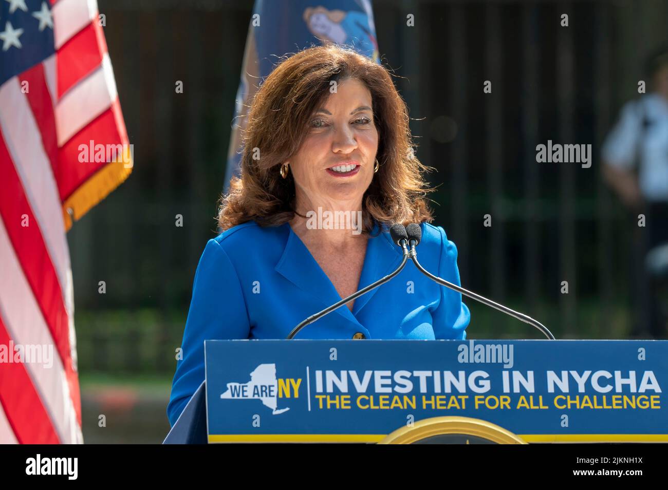 Governor Kathy Hochul speaks during a joint housing and clean energy-related announcement at Woodside Houses NYCHA complex in Queens Borough of New York City. Governor Hochul and Mayor Adams announce $70 million initial investment to decarbonize NYCHA buildings as part of clean heat for all challenge. The plan calls for the installation of what's called an 'electric heat pump', developed by NYPA selected Midea America and Gradient, in 30,000 units, which would provide tenants in each apartment with the ability to control the heat or keep their units cool throughout the year. Stock Photo