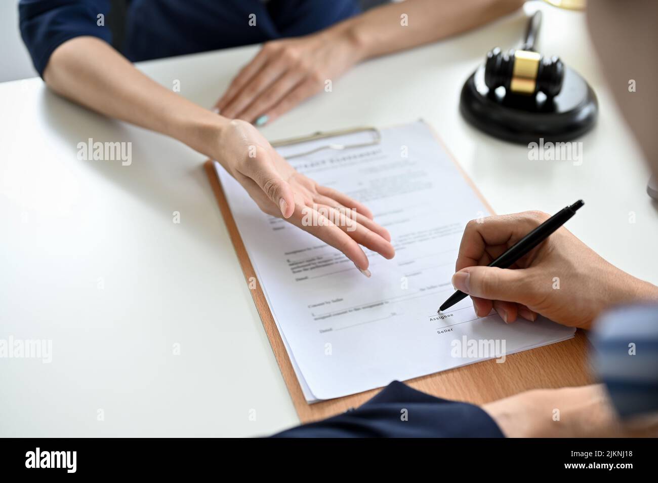 Cropped and close up shot A male client sign his signature on a