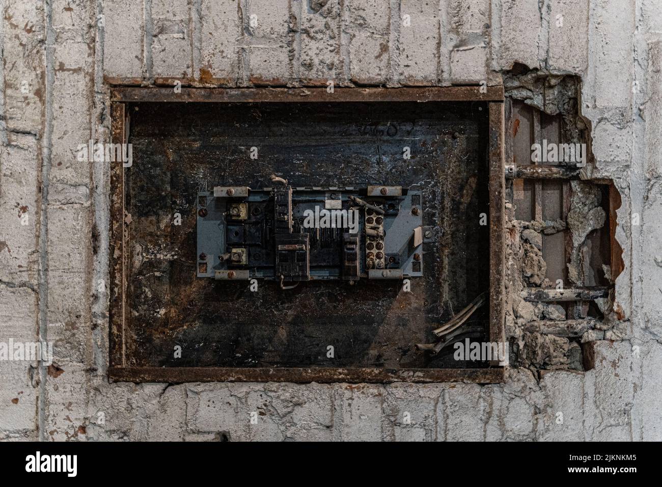 A vintage electrical panel in an abandoned warehouse Stock Photo