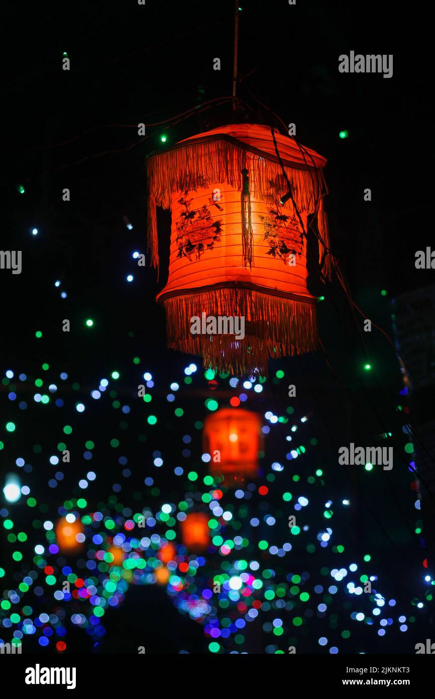 A vertical shot of flying lantern in dark sky during lantern festival