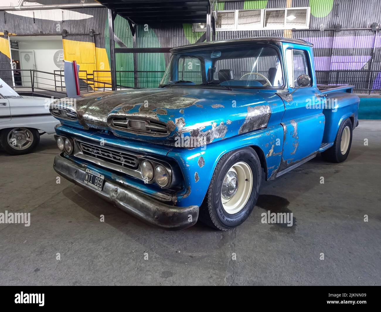 Avellaneda, Argentina - Mar 19, 2022 - old blue unpainted Chevrolet Chevy C10 Apache pickup truck 1960-1961 parked in a warehouse yard. Utility or far Stock Photo