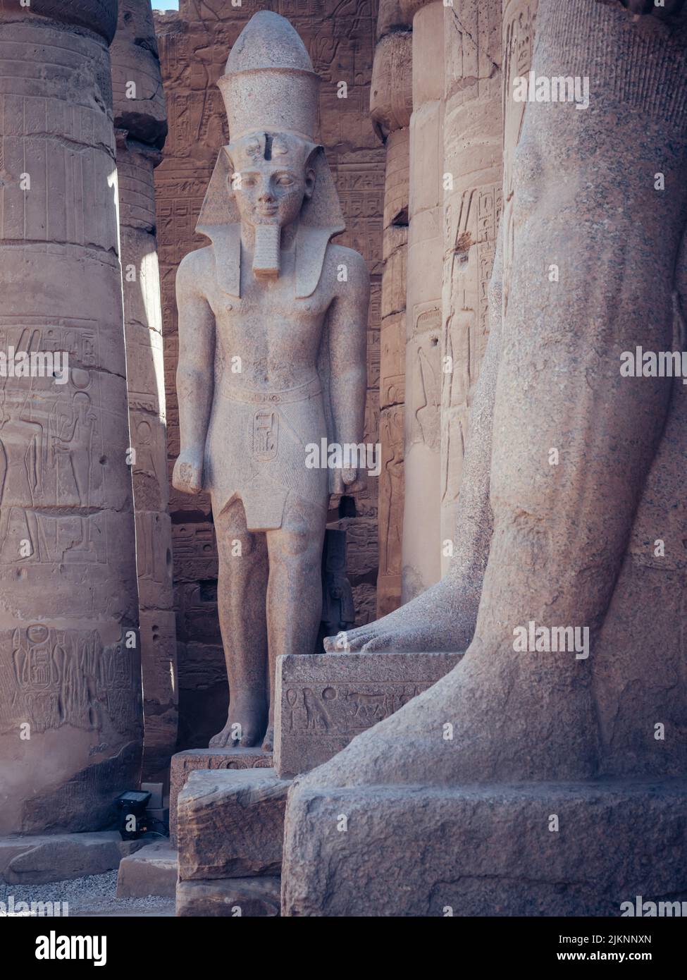 A vertical shot of a pharaoh statue in the Mortuary Temple of Hatshepsut in Egypt Stock Photo