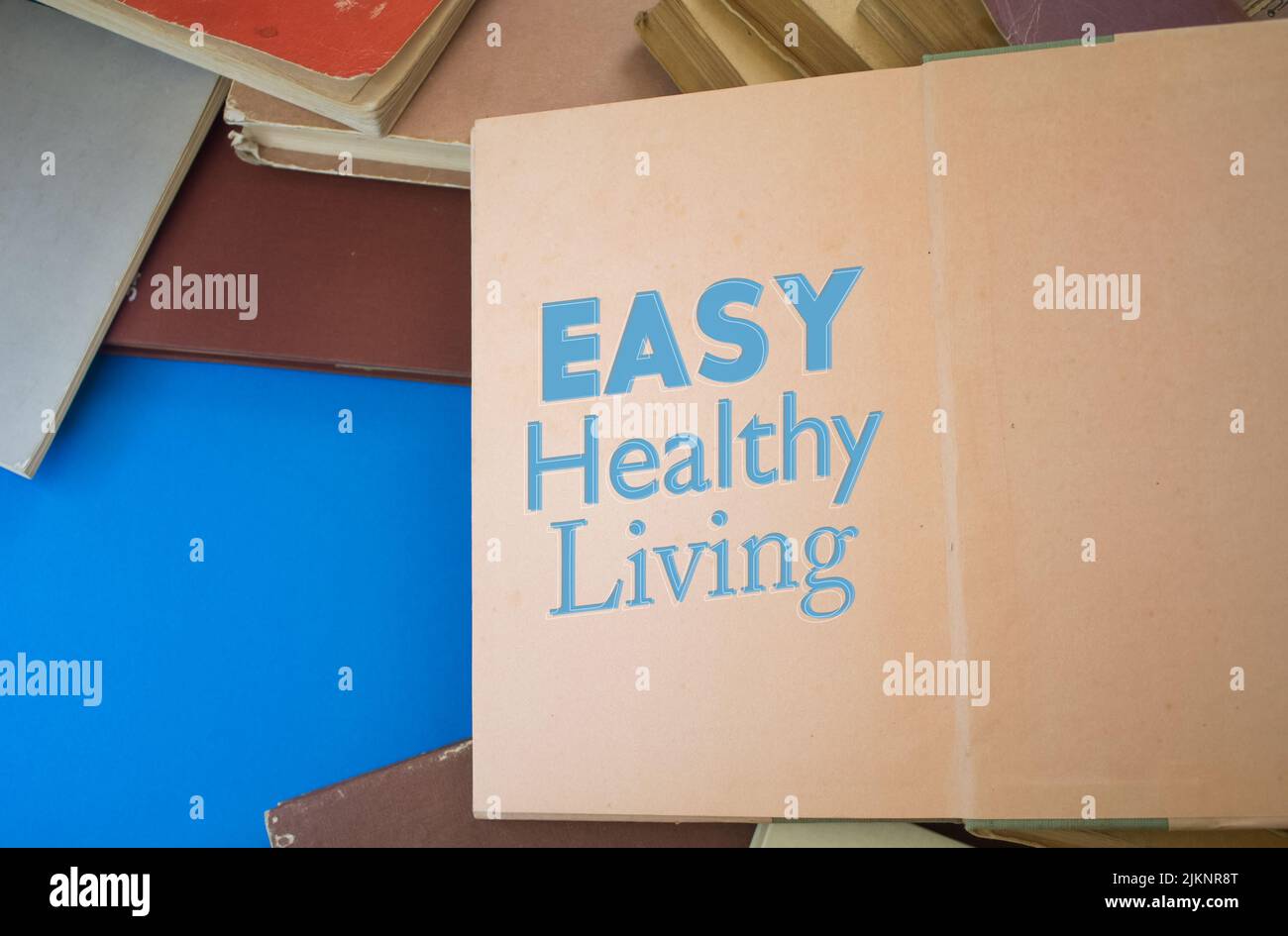 Easy Healthy Living word in opened book with vintage, natural patterns old antique paper design. Stock Photo