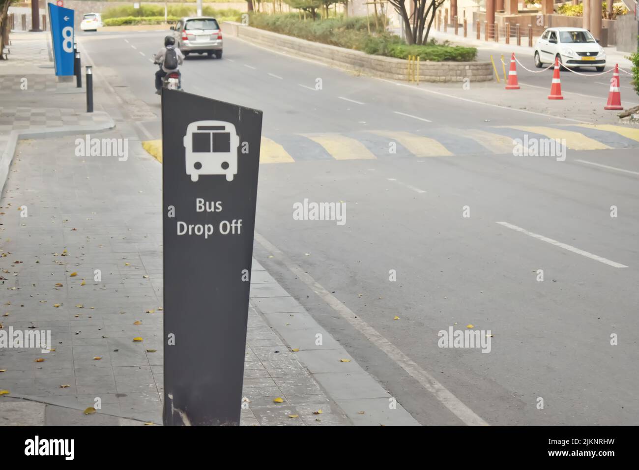 A Selective focus Picture of a Bus Drop Off area Sign with Background blur in a Software Park in India. Stock Photo