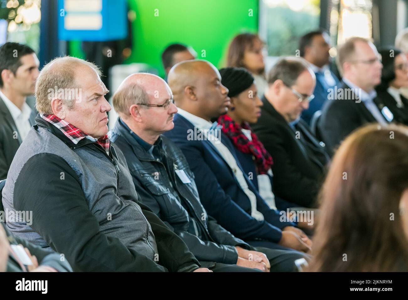 A group of delegates networking at a business conference in