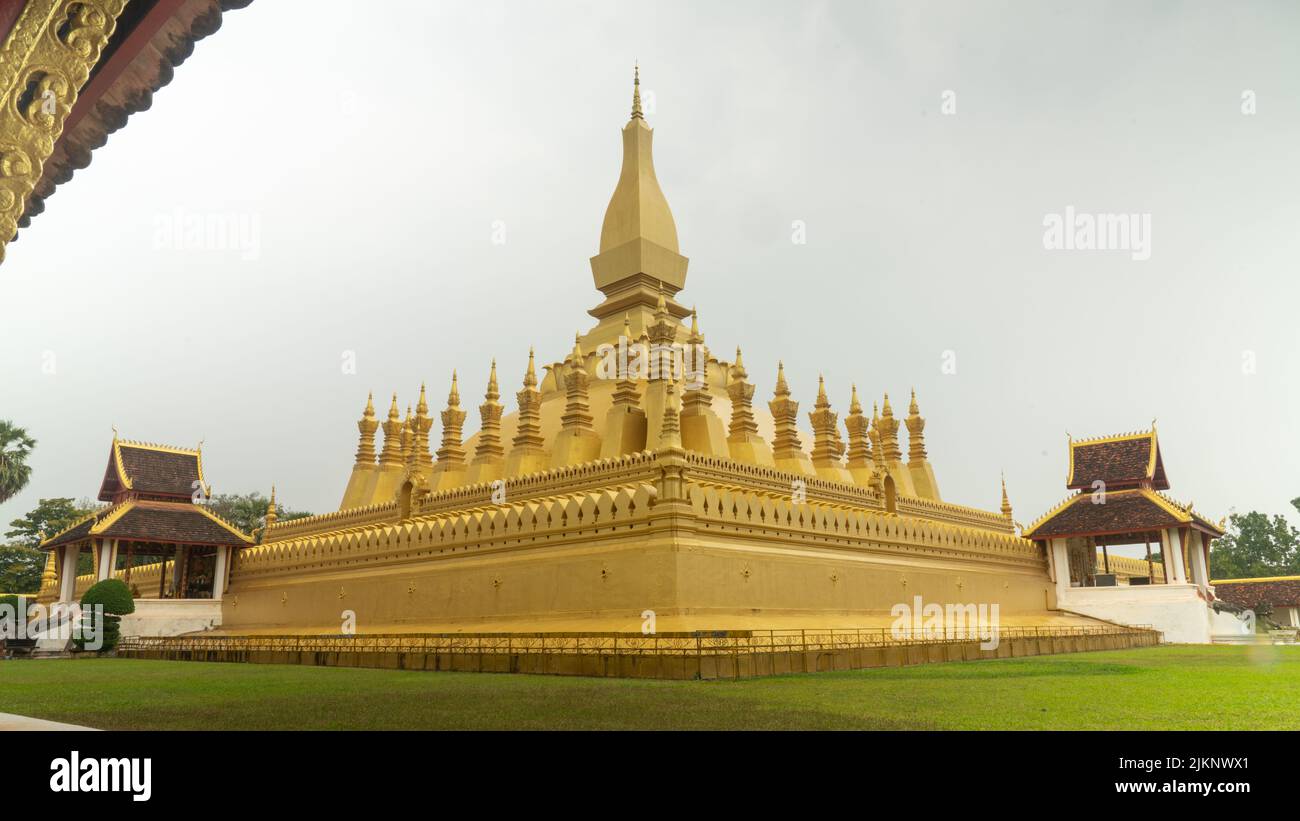 A gold-covered large Pha That Luang Buddhist stupa in Vientiane, Laos Stock Photo