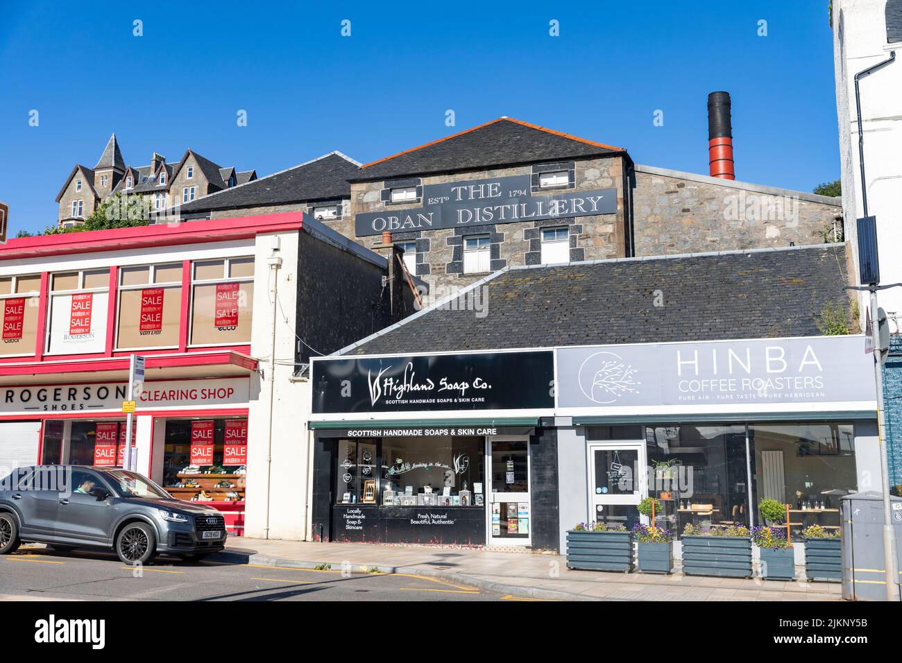 Oban distillery and Oban high street,Oban Scotland on a sunny blue sky day, July 2022,UK Stock Photo