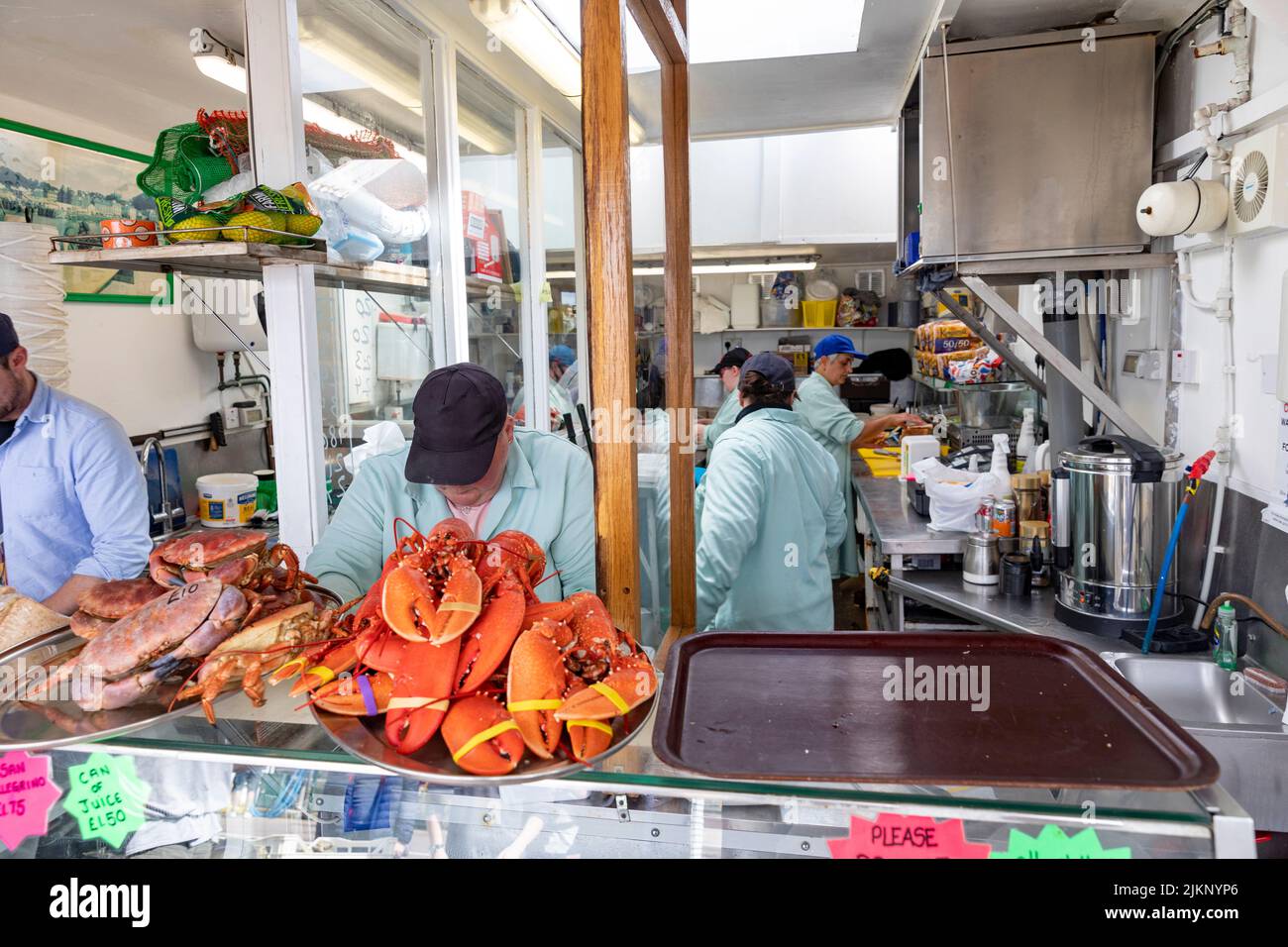 Seafood Hut Oban quayside pier, staff prepare fresh seafood in the