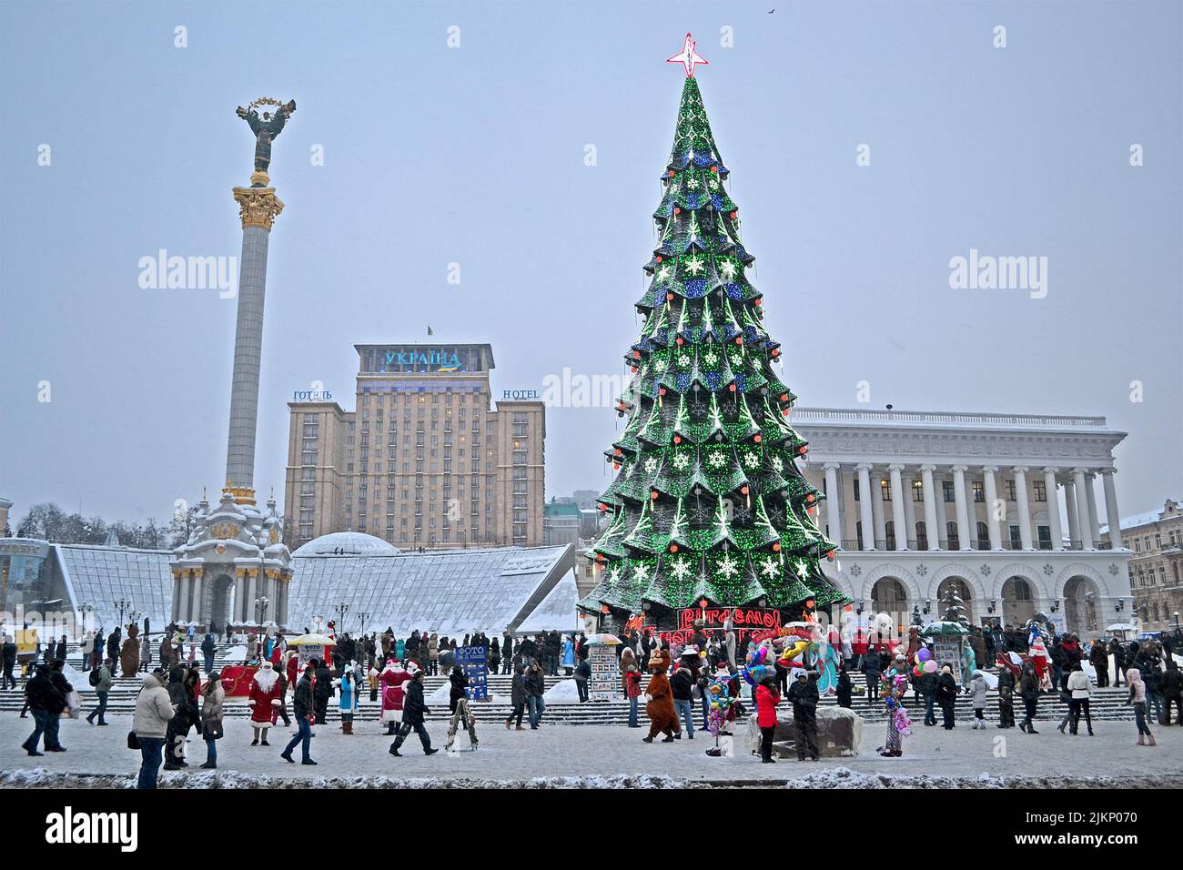 Christmas Tree and Independence monument in Kiev, Ukraine. Santa Clasus Parade starts on Kreshatik street. Stock Photo