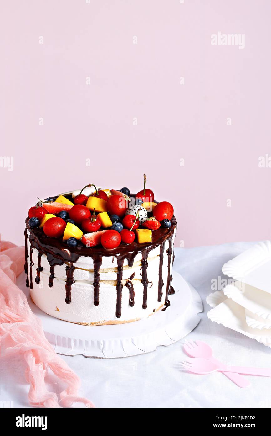 A vertical shot of a sweet cake on the bright background Stock Photo