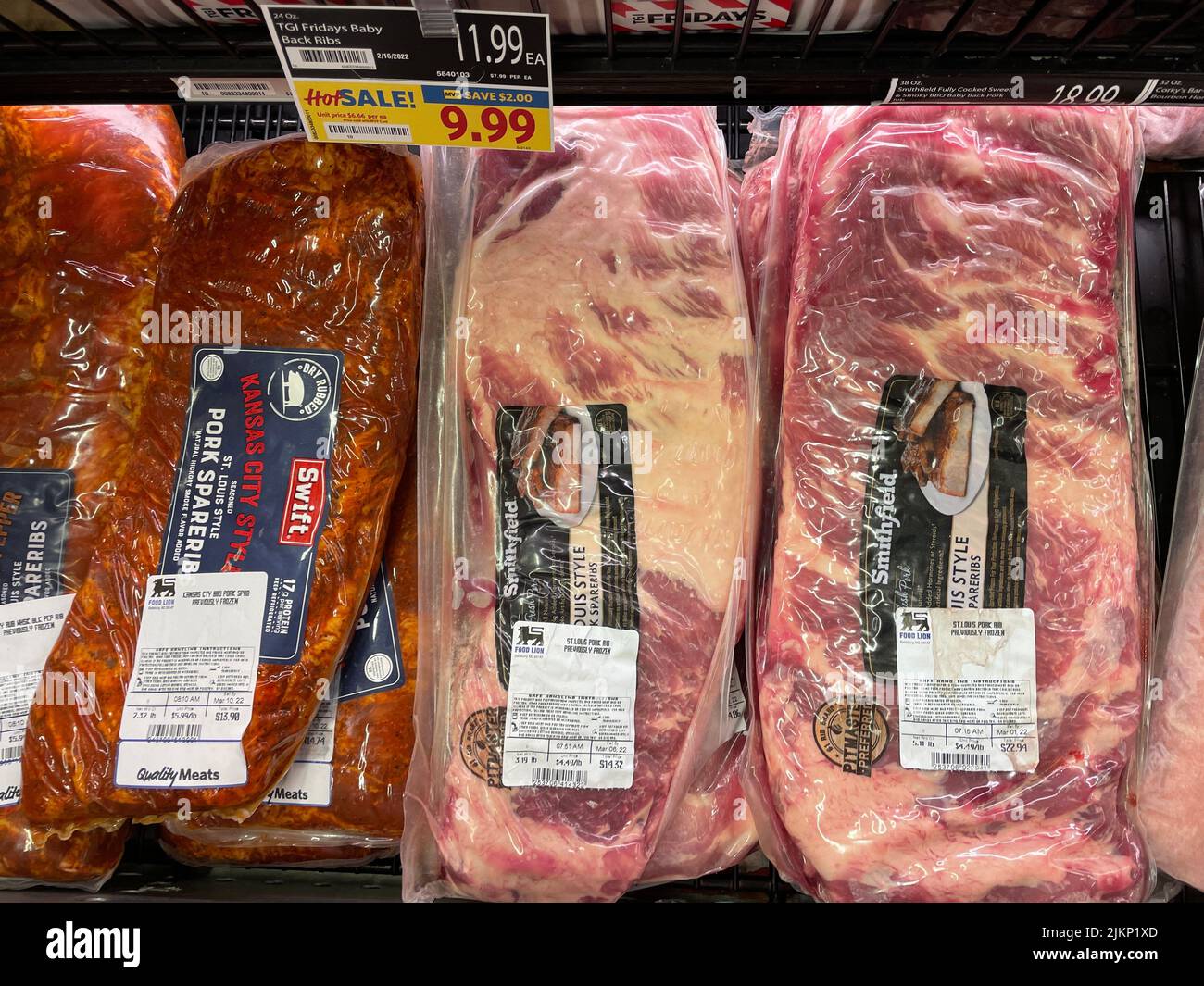 A retail grocery store shelf with Kansas City Style and Smithfield meats Stock Photo