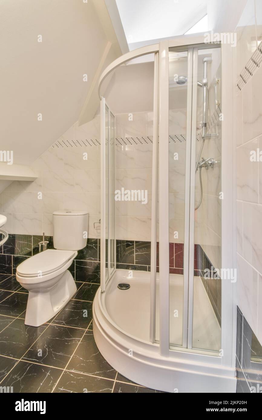 Interior of contemporary bathroom with shower and toiled white walls in ...