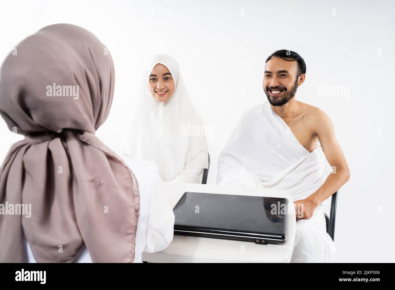 Husband and wife of prospective Hajj pilgrims consult with doctors