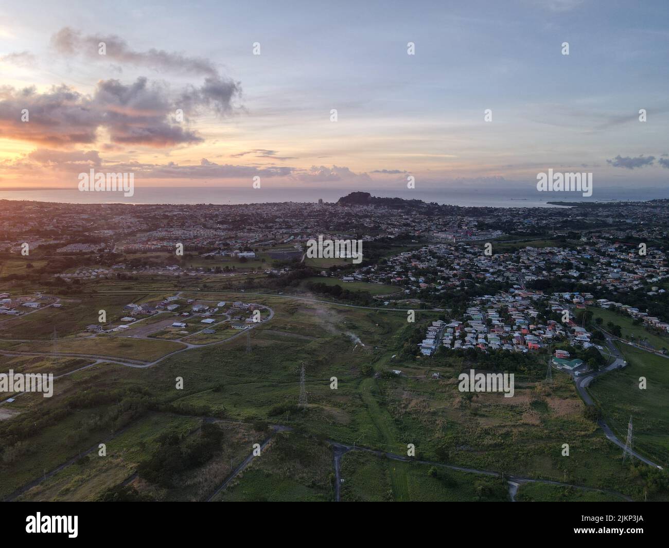An aerial view of the cityscape of San Fernando against the dusk sky at sunset in Trinidad and Tobago Stock Photo