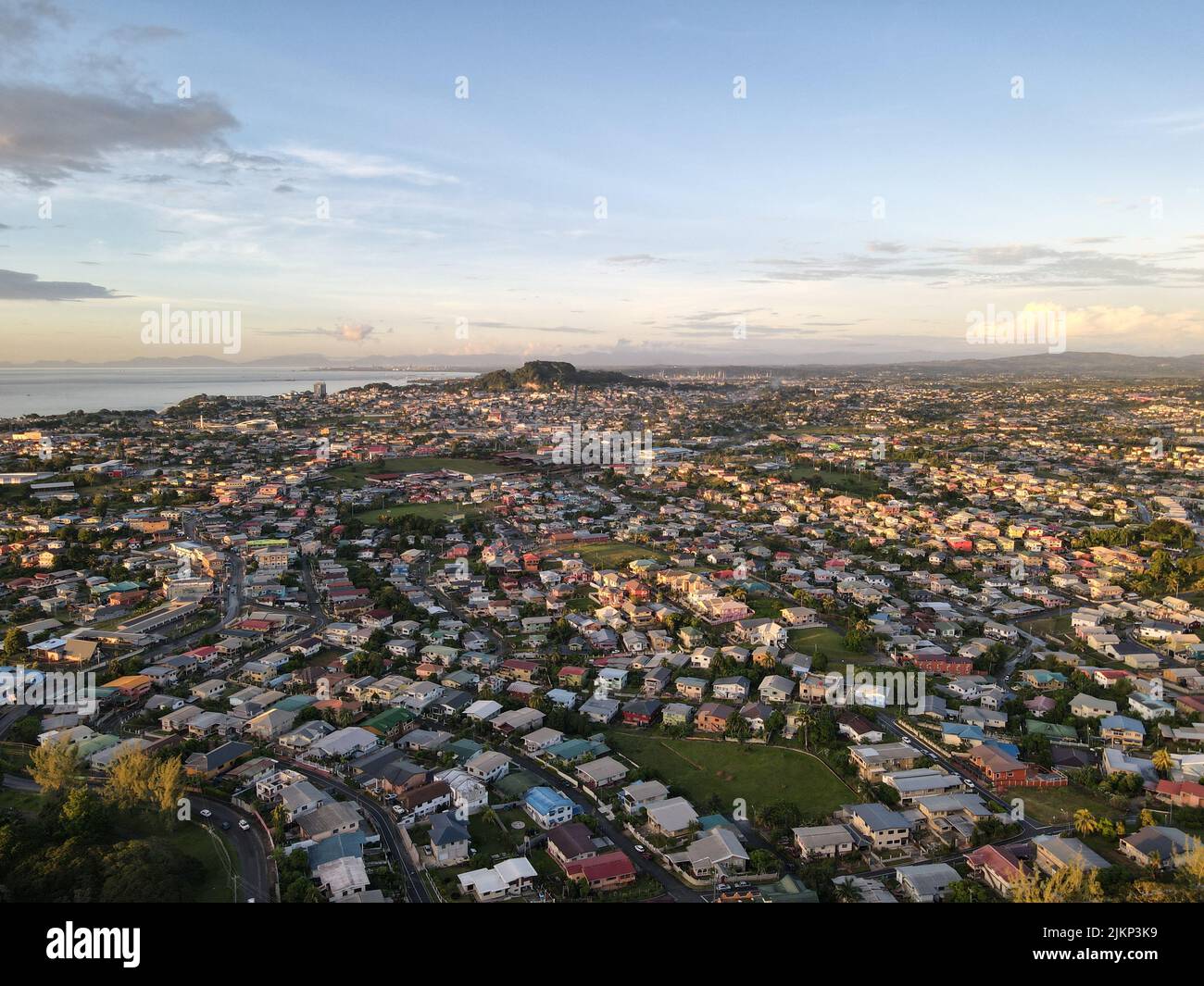 An aerial view of the cityscape of San Fernando against the dusk sky at sunset in Trinidad and Tobago Stock Photo