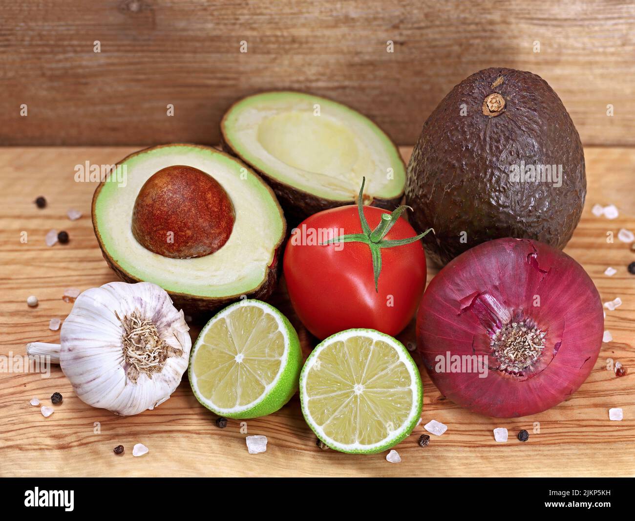 fresh ingredients for a healthy guacamole on wooden background Stock Photo