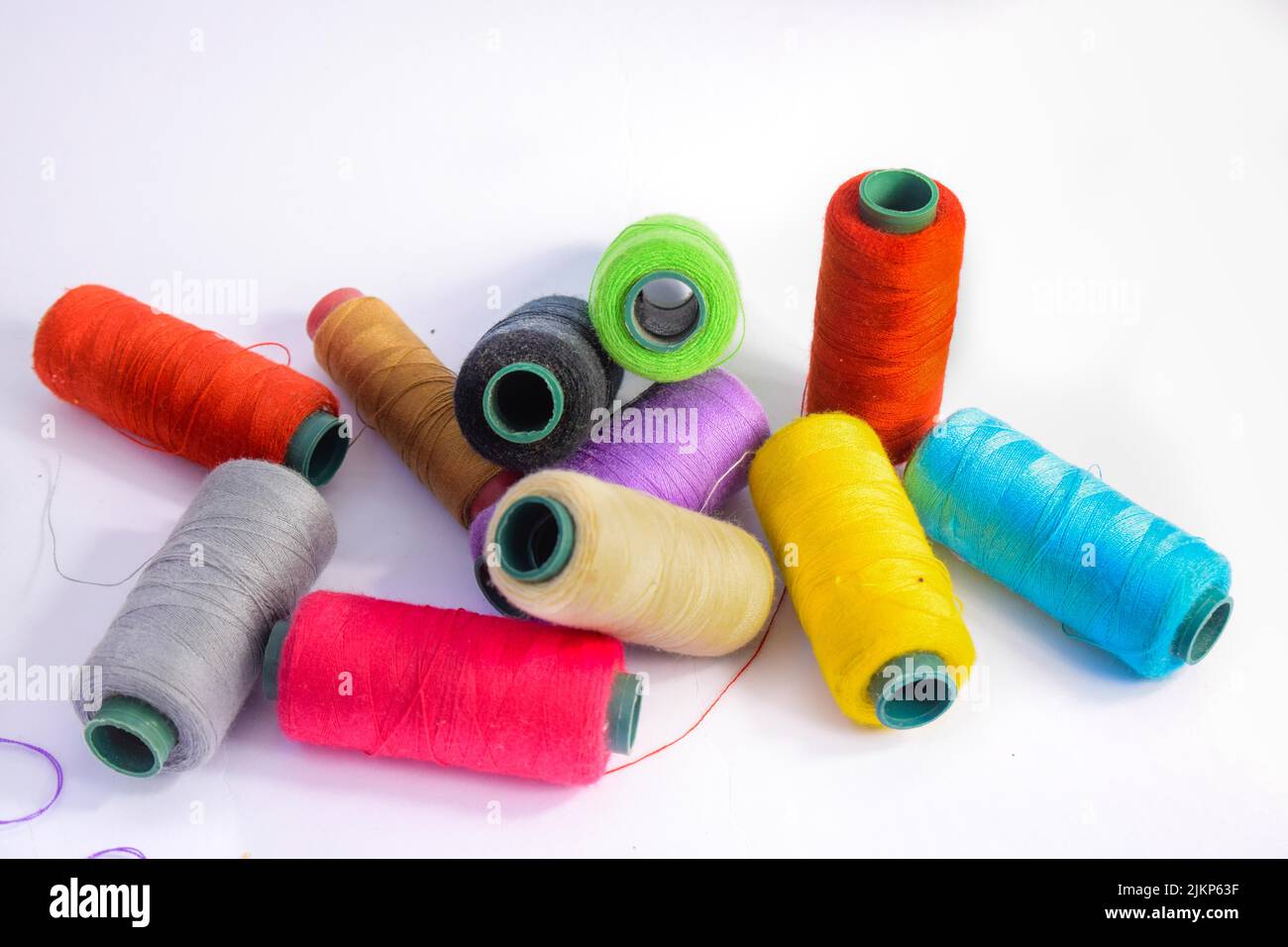Vibrant colorful threads on a white background Stock Photo