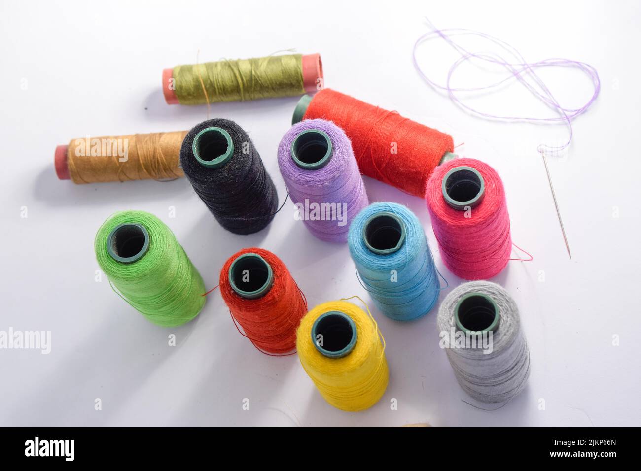 Vibrant colorful threads on a white background Stock Photo - Alamy