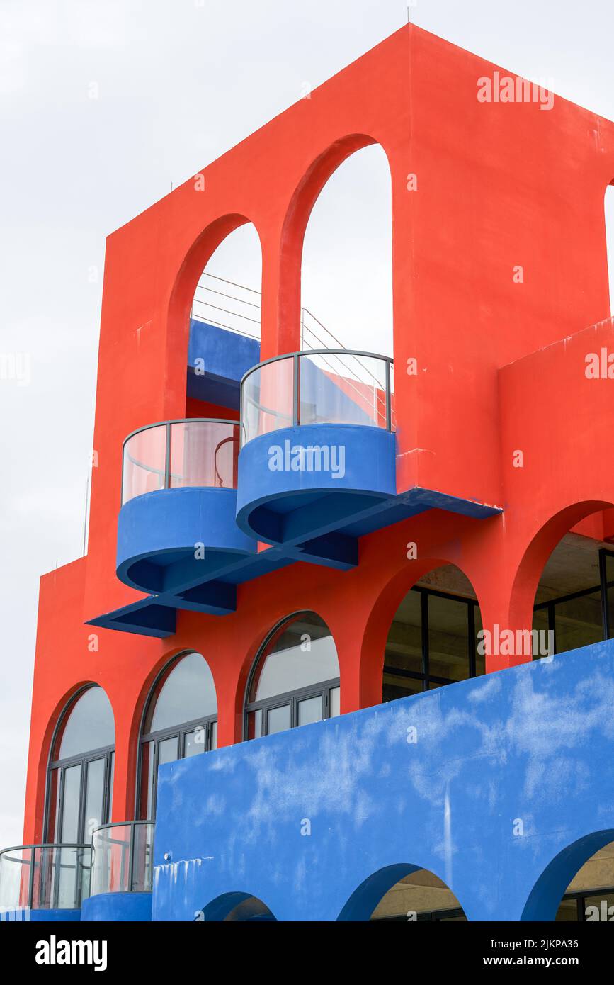 Close-up of modernist buildings in contrasting red and blue colors Stock Photo