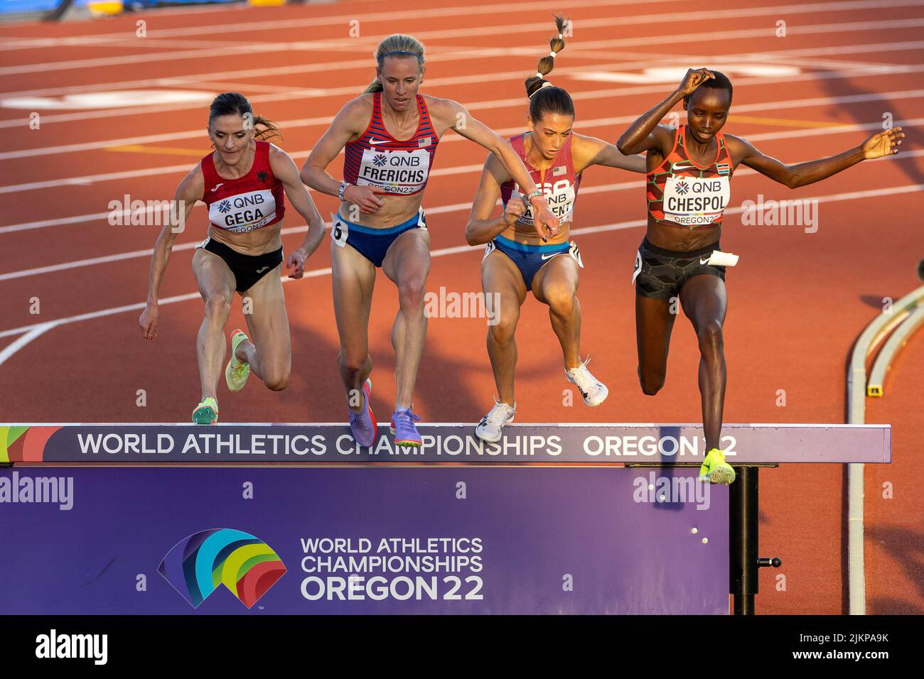 Luiza Gega (ALB), Courtney Frerichs (USA), Courtney Wayment (USA), and Celliphine Chepteek Chespol (KEN) arrive at the water barrier in the 3000 meter Stock Photo