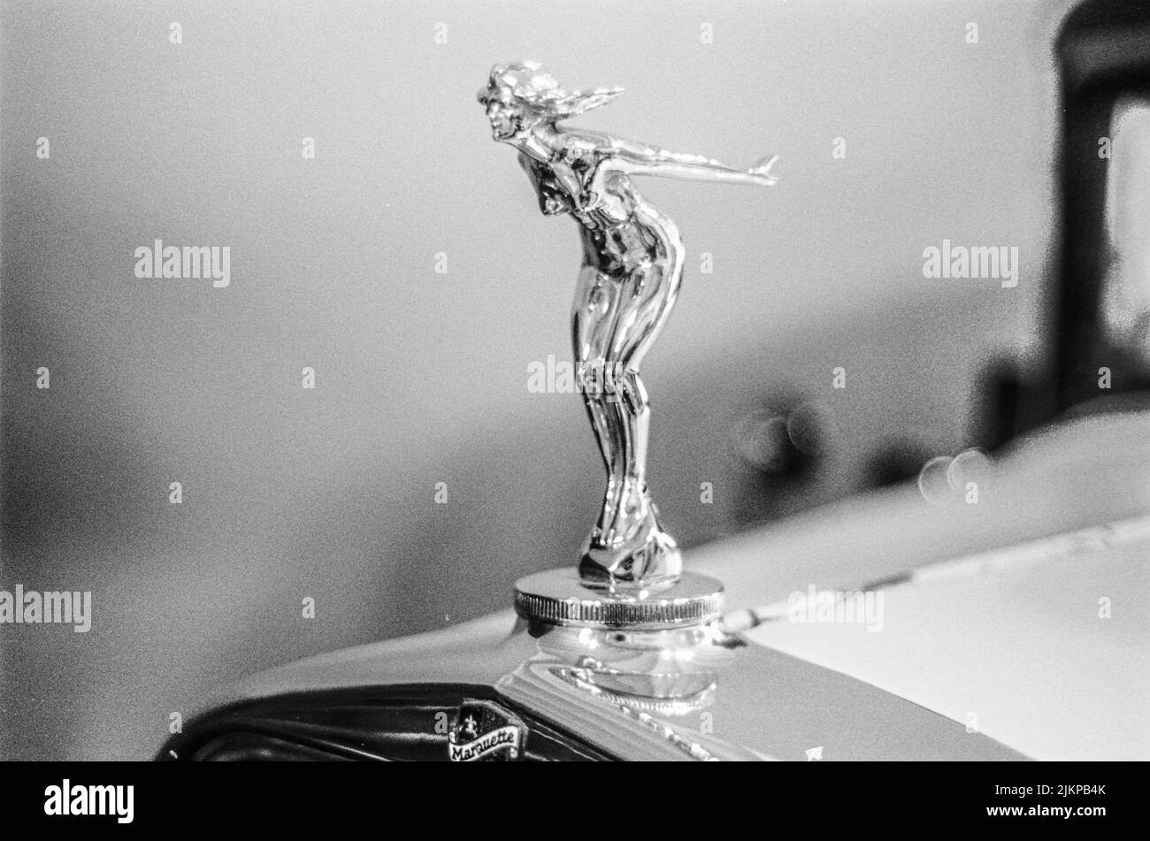 Very old car of private collection, logo emblem photo in black and white film camera Stock Photo