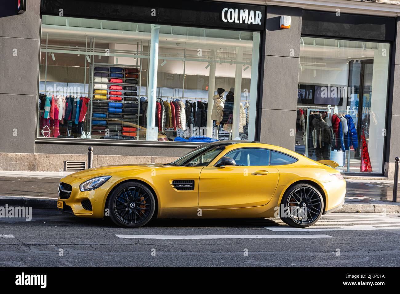 Yellow super car parked in the street. Mercedes Benz AMG GT Stock Photo