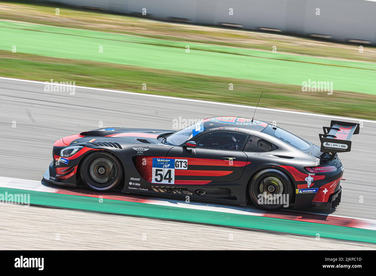 Fast race car in the wet track, Mercedes Benz AMG GT3 Stock Photo