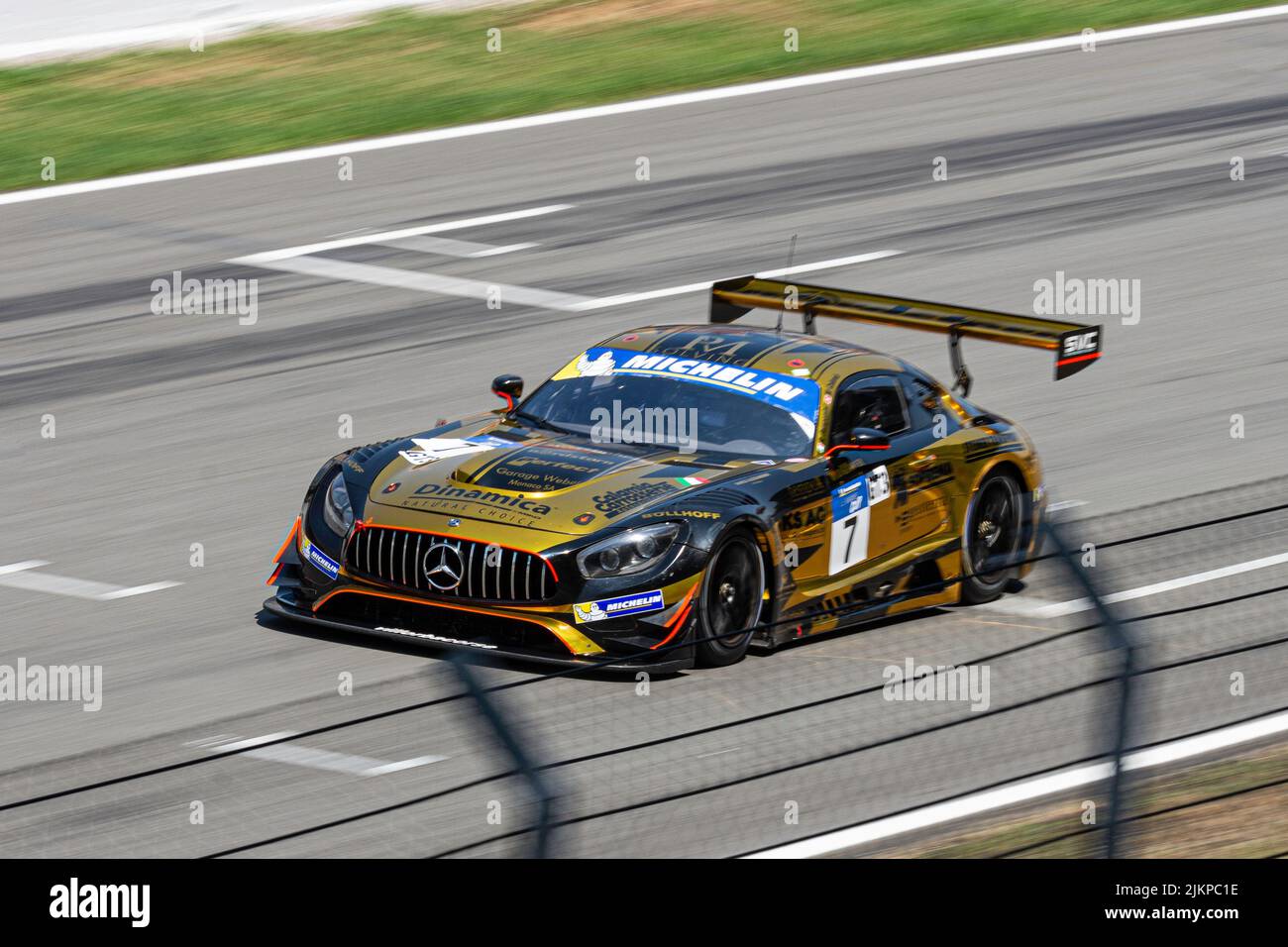 Fast race car in the wet track, Mercedes Benz AMG GT3 Stock Photo