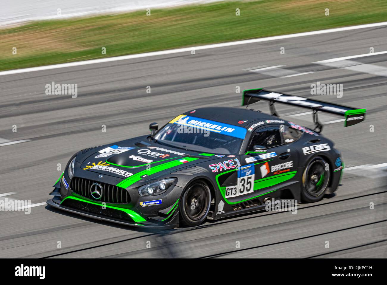 Fast race car in the wet track, Mercedes Benz AMG GT3 Stock Photo