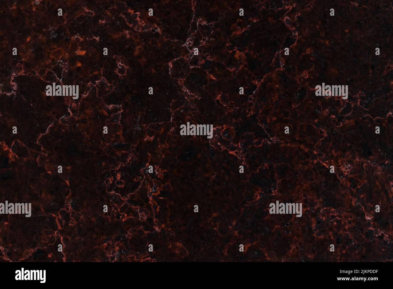 Black marble texture with red veins. Abstract background photo, front view Stock Photo
