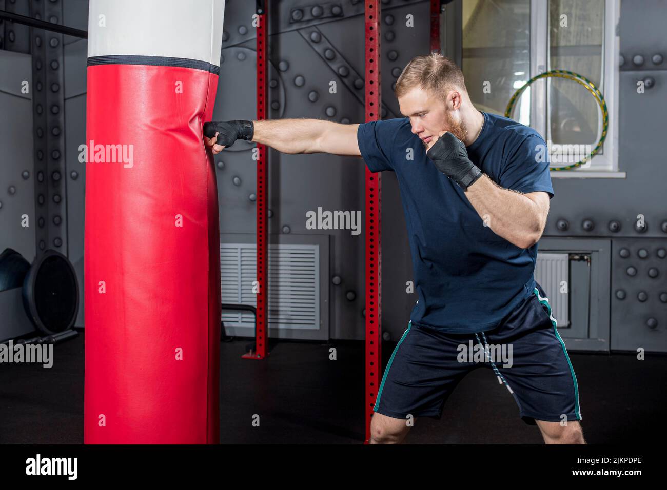 Young strong bearded man, mixed martial arts fighter and trainer