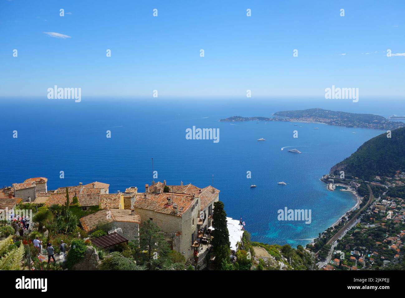 An aerial view of the blue seascape and a buildings on the shoreline in Eze, South France Stock