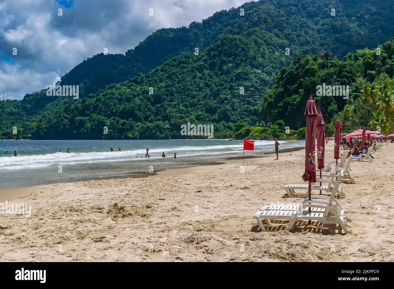 A Caribbean swimming beach on Maracas Bay in Trinidad. A line of beach