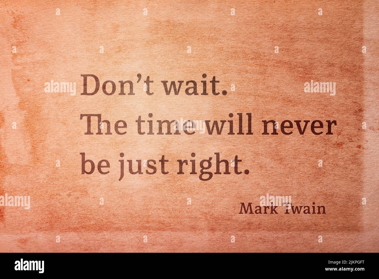 Don’t wait. The time will never be just right  - famous American writer Mark Twain quote printed on vintage grunge paper Stock Photo